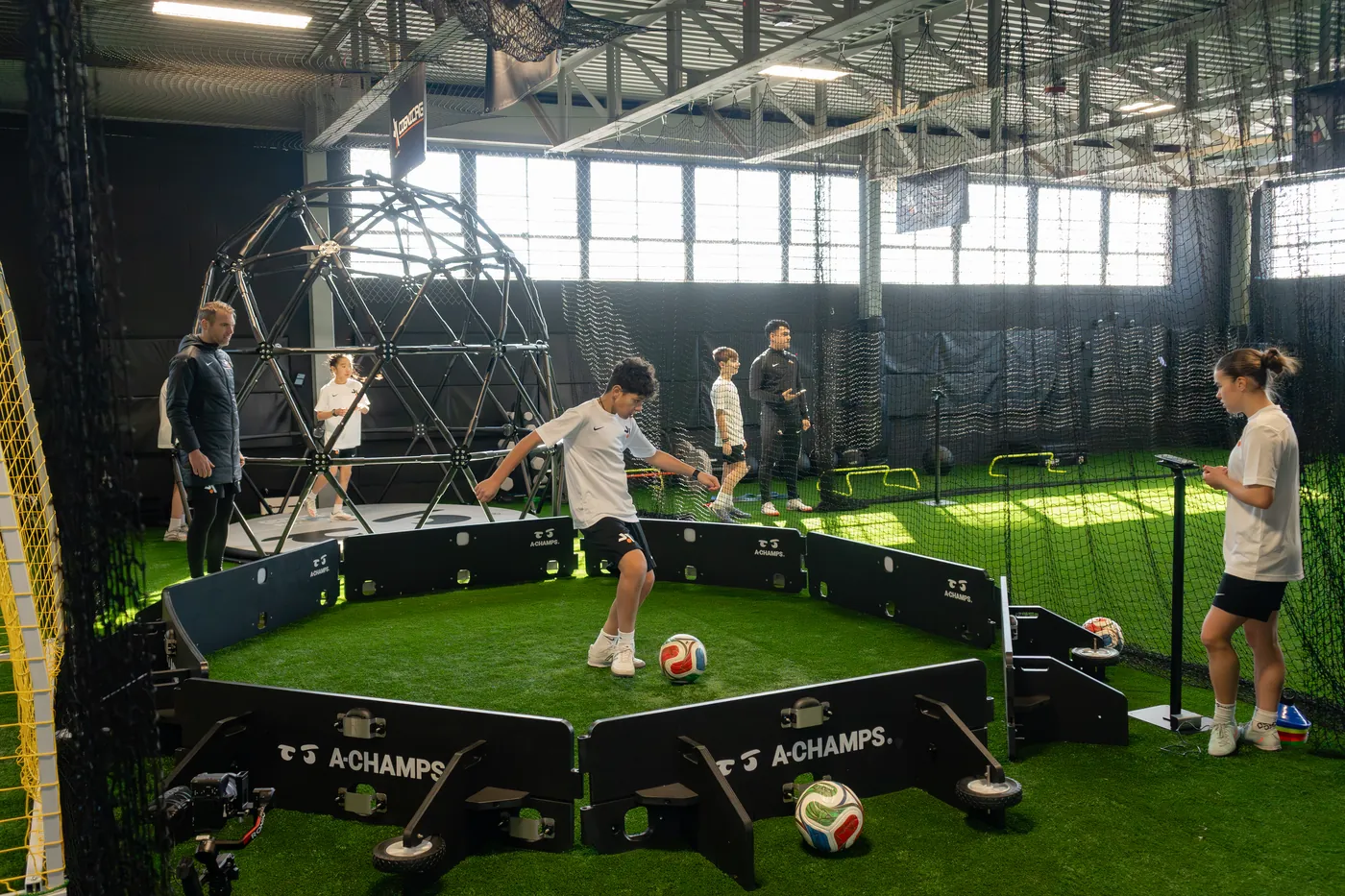 Inside the Soccer Performance Lab training hall with the reaction light arena and the performance dome